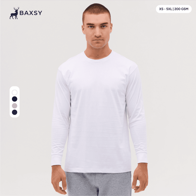 A long sleeve tee in white, featuring a relaxed fit and a logo on the upper left side.