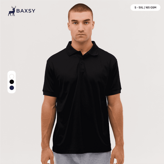 A black polo shirt displayed on a model, featuring a collar and short sleeves. It has a branding logo.