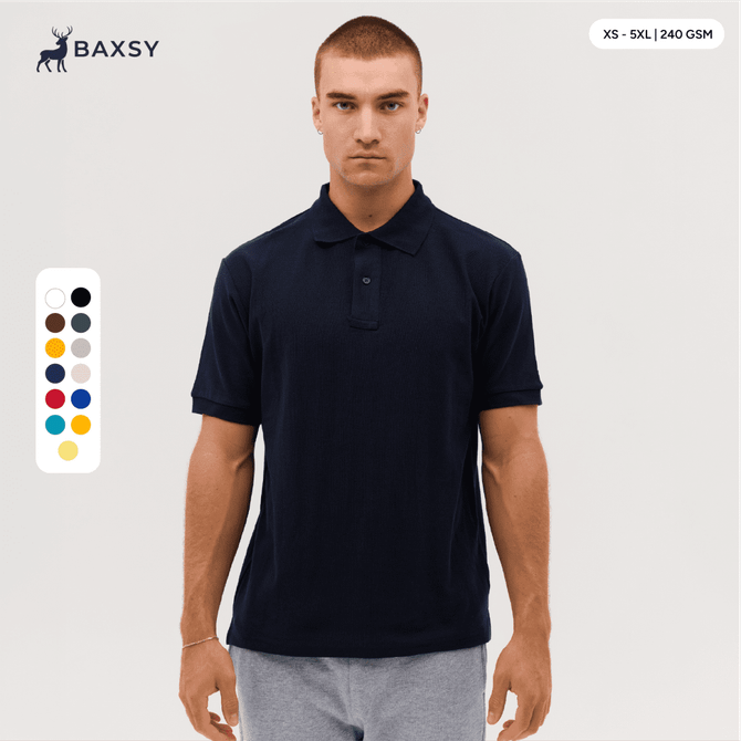 A model wearing a navy polo shirt with a collar, featuring short sleeves and a subtle logo. Various colour swatches are visible.