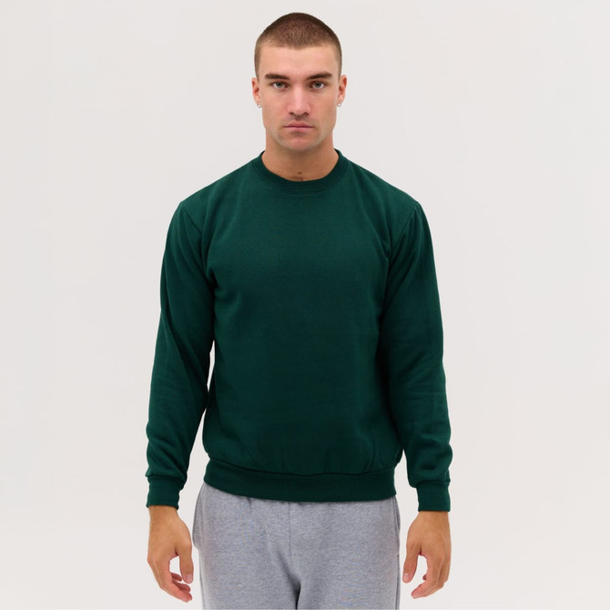 A green crewneck sweatshirt worn by a model, featuring long sleeves and a classic fit, against a plain background.