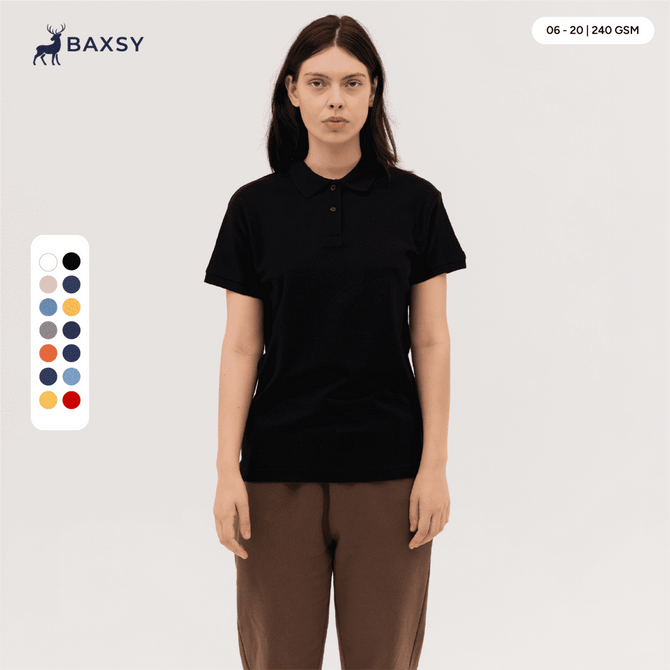 A woman wearing a black polo shirt stands against a neutral background. The shirt features a collar and short sleeves.