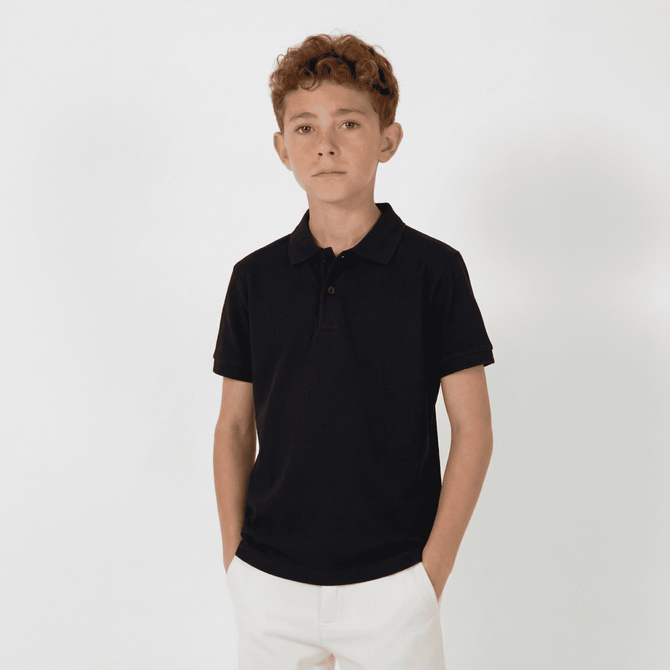 A youth black polo shirt with a collar and short sleeves, featuring a logo on the chest.