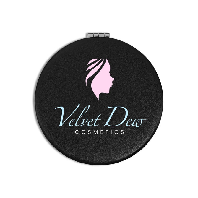A round black compact mirror featuring a logo with a profile silhouette and "Velvet Dew Cosmetics" text.