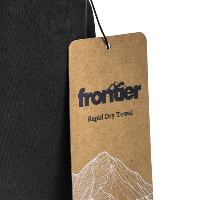 A black rapid dry towel with a tag featuring a logo and mountain design.