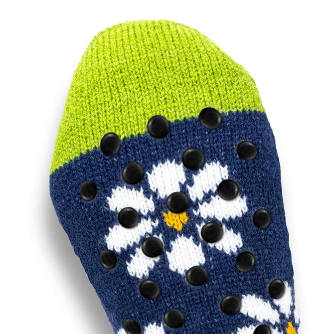 Custom cosy socks featuring a navy blue base with a floral pattern and a bright green top, adorned with grip dots.