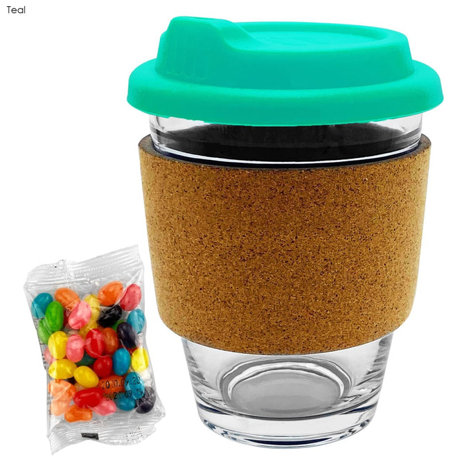 A glass coffee cup with a teal lid, cork band, and a side of colourful jelly beans.