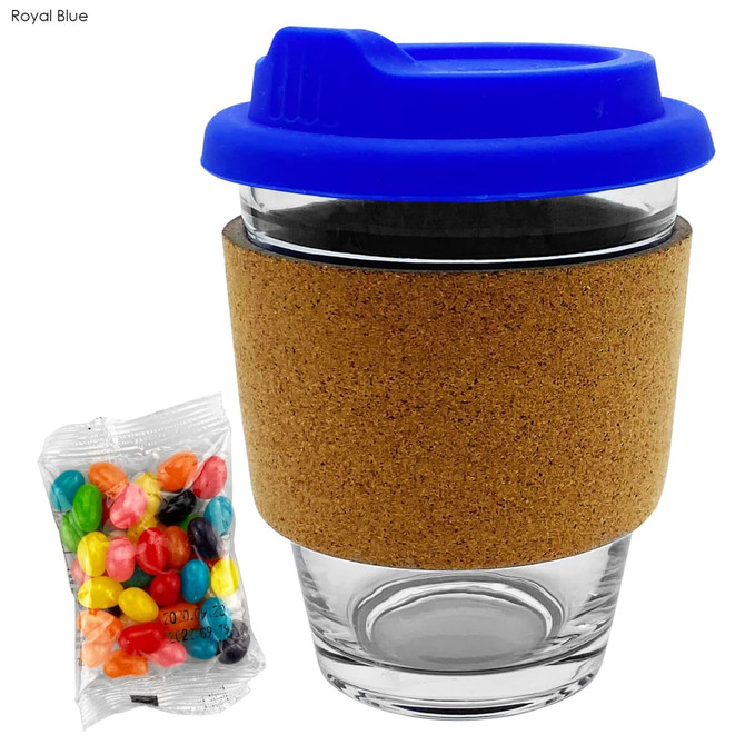 A glass coffee cup with a royal blue lid and a cork band, accompanied by a packet of colourful jelly beans.