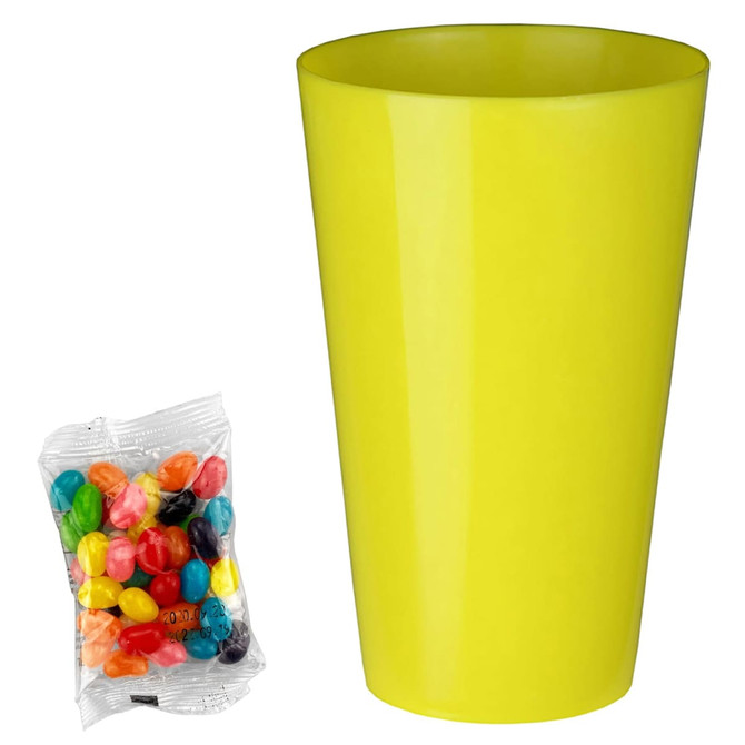 A bright yellow cup alongside a pack of multicoloured jelly beans in various shades.