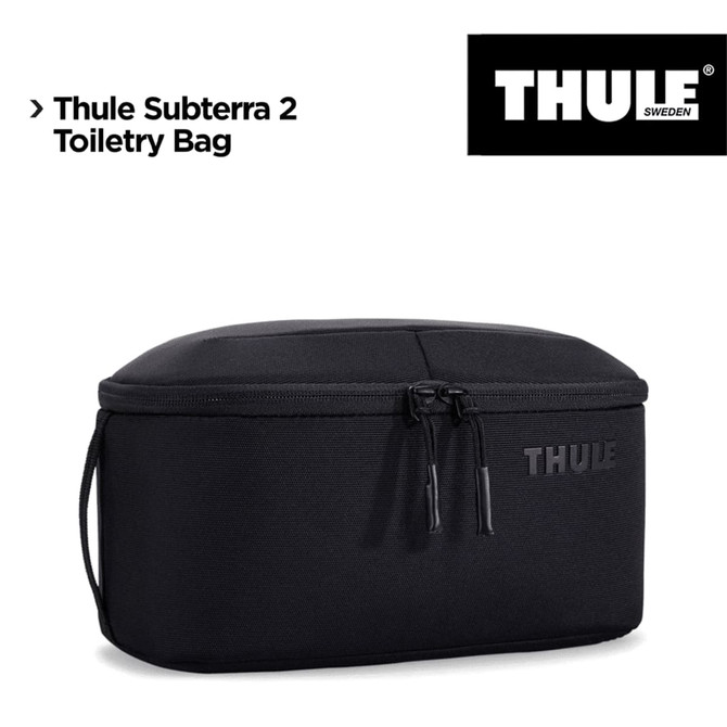 A black Thule Subterra 2 Toiletry Bag with a removable pouch and a logo on the side.