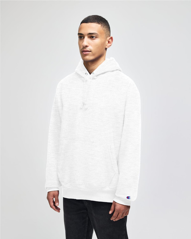 A white pullover hooded sweatshirt with a front pocket and a logo on the sleeve, worn by a model.