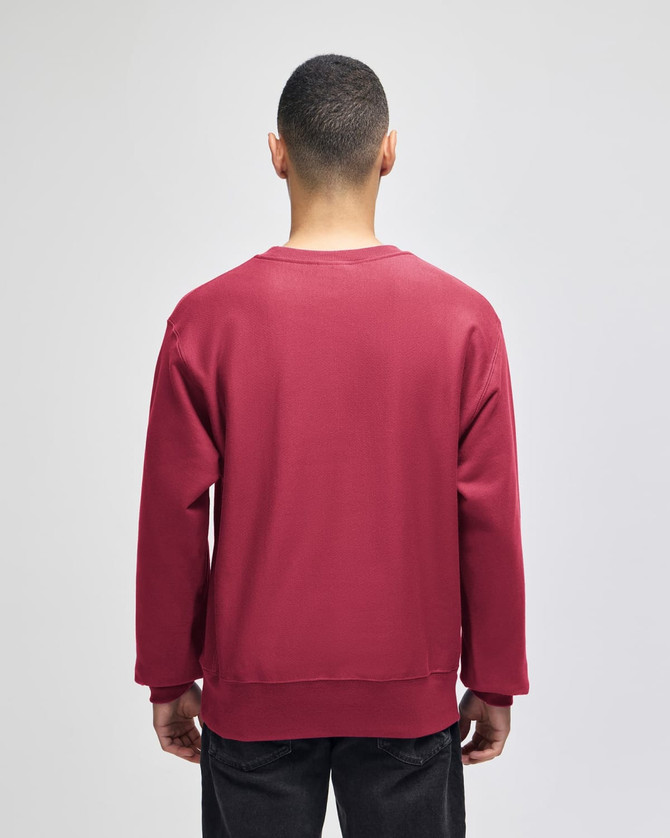 A red Champion Reverse Weave® adult crew sweatshirt, featuring a back view, with long sleeves and a relaxed fit.