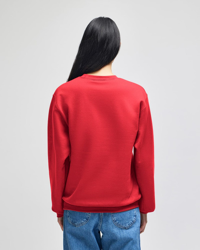 A red adult crewneck sweatshirt with a relaxed fit, viewed from the back, worn with blue jeans. It has a logo.