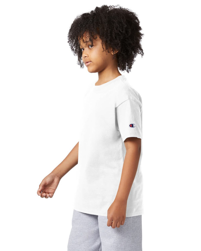 A white short sleeve t-shirt for youth, featuring a logo on the sleeve. The model is posed sideways.