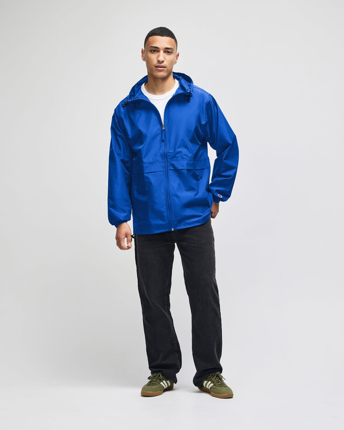 A blue full-zip anorak jacket with a hood, featuring a front pocket and a logo.