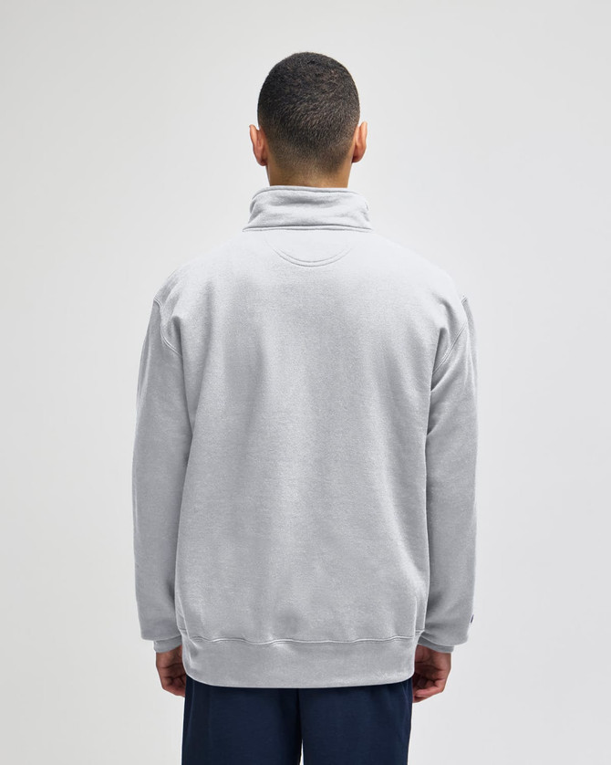 A grey quarter-zip pullover jacket displayed from the back, featuring a collar and a logo.
