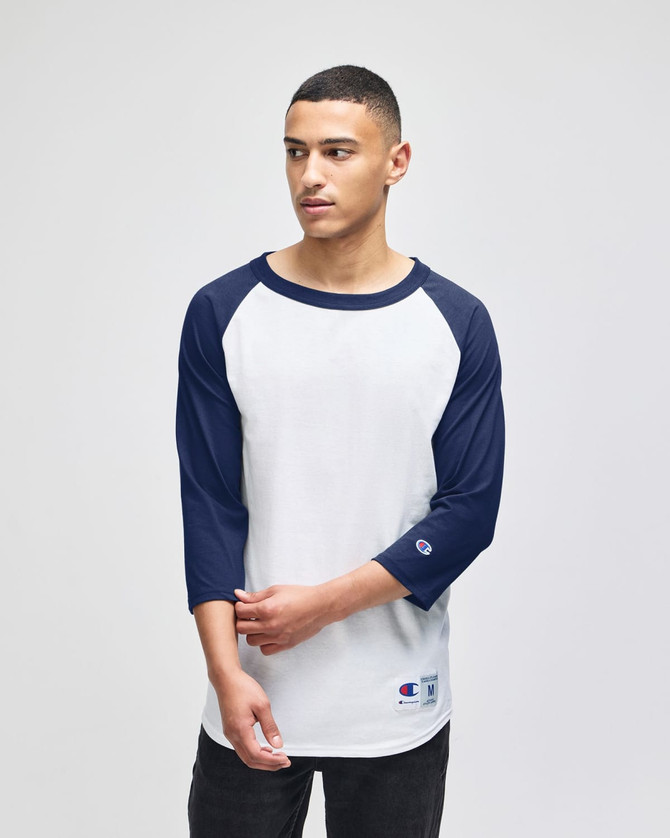 A white and navy raglan baseball T-shirt for adults, featuring long sleeves and a crew neck. It has a logo.