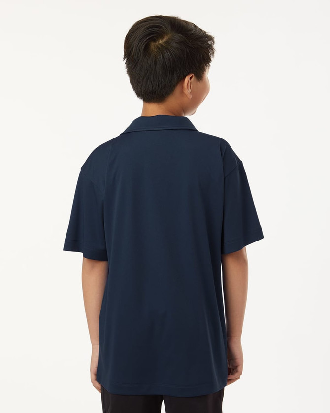 A navy performance polo shirt for youth, featuring a short-sleeve design and a branding logo on the back.