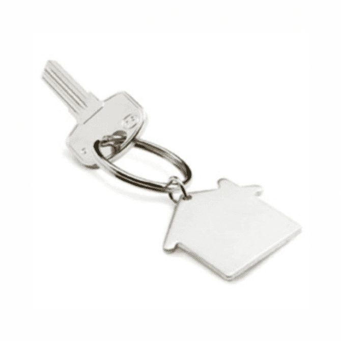 A silver key with a keyring shaped like a house. The key has a simple, sleek design.