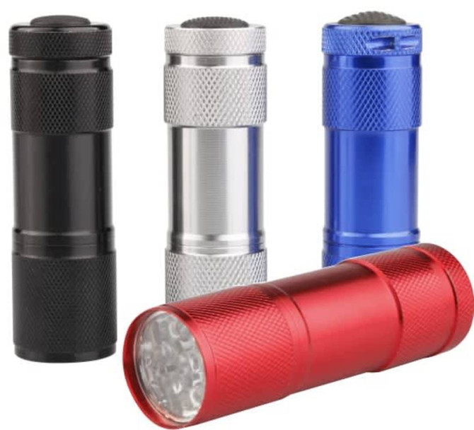 A set of four small torches in black, silver, blue, and red, featuring textured bodies and a front LED light.