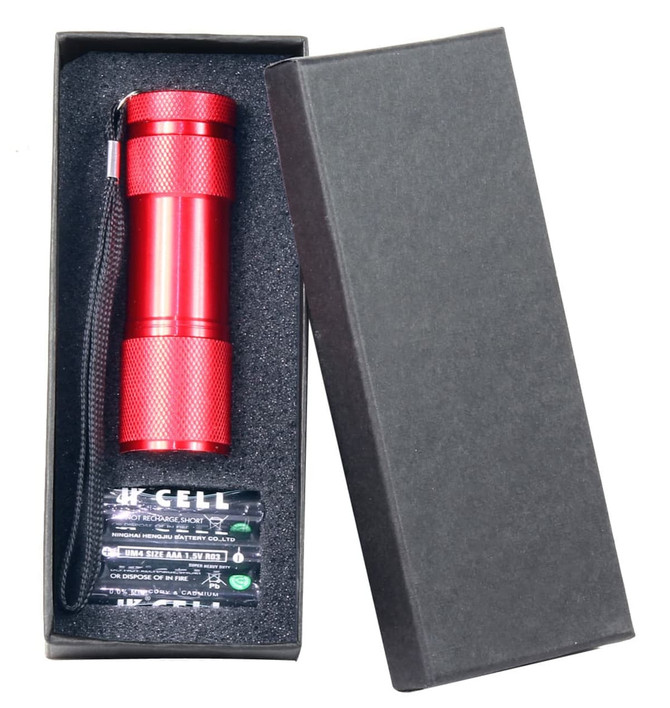 A drink bottle in a sleek black box with a red, textured exterior and a matching strap. It features a logo.