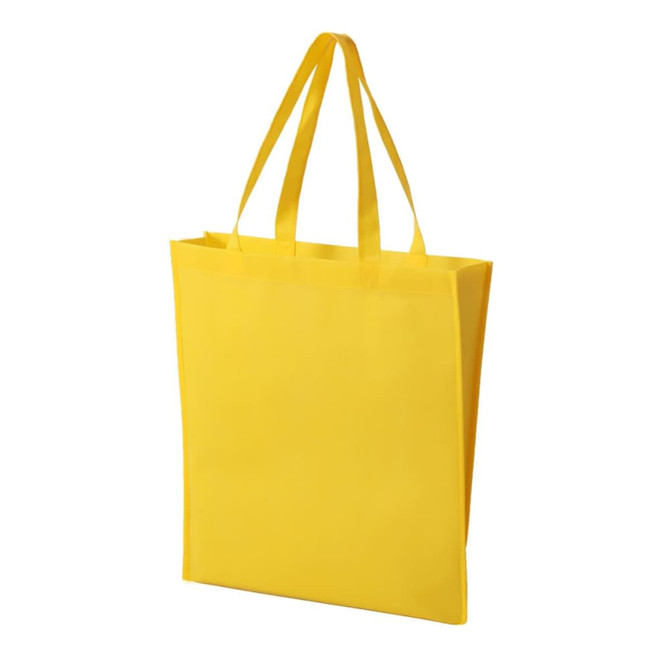 A yellow non-woven tote bag with two handles and a simple design, featuring a logo on one side.