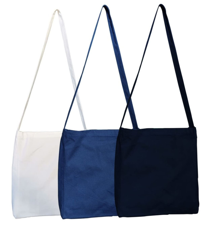 A set of three fabric bags in white, blue, and navy, each with a long strap and a simple design.