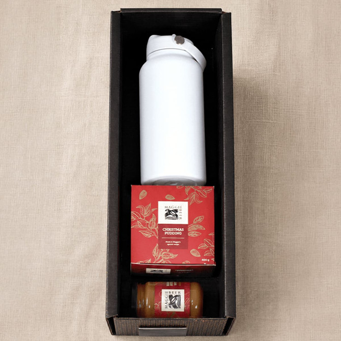 A white drink bottle, Christmas pudding box, and a small jar in a black gift box.
