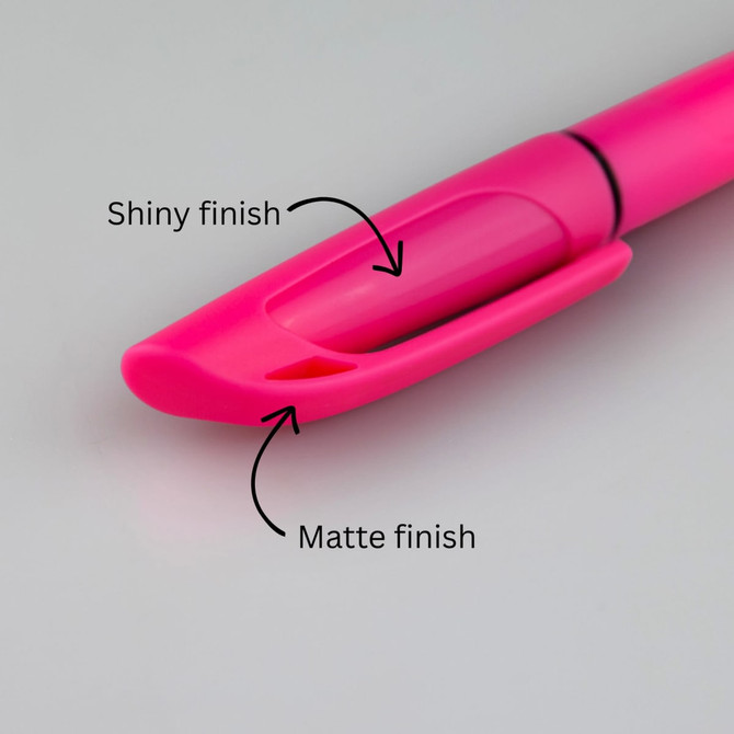 A pink highlighter with a shiny and matte finish, featuring a clip for easy attachment.