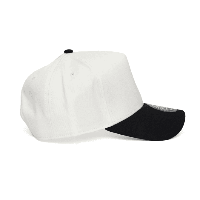 A two-tone cap in white and black with a visible logo, featuring a structured design and flat brim.