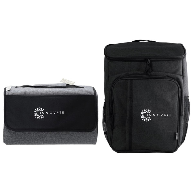 A grey picnic blanket and a black cooler bag, both featuring a logo.