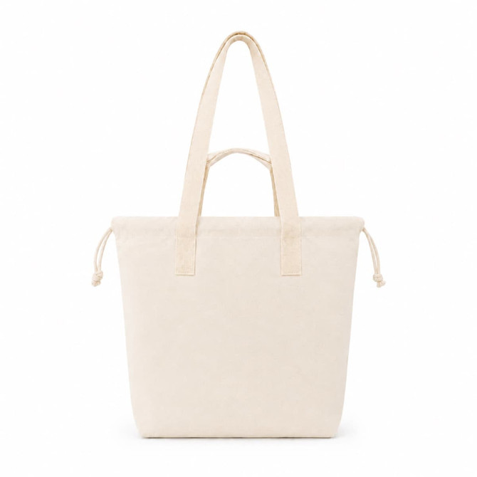 A light beige tote bag with two shoulder straps and a drawstring closure at the top. It has a simple branding logo.