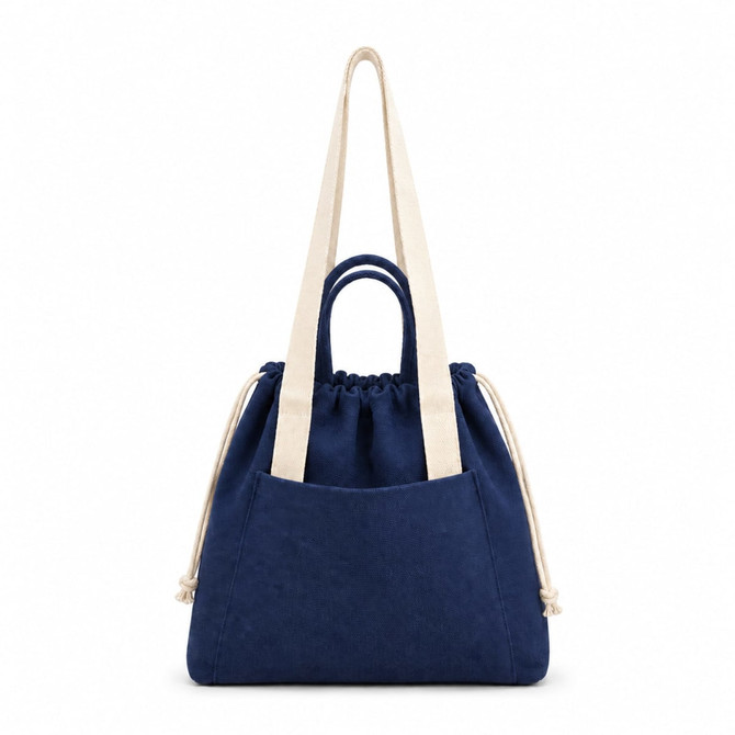 A navy tote bag with cream handles and a drawstring closure, featuring a front pocket and branding.