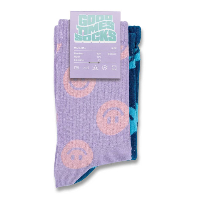 A pair of pixel knitted bamboo crew socks in lavender and blue, featuring playful patterns. Includes branding on the label.