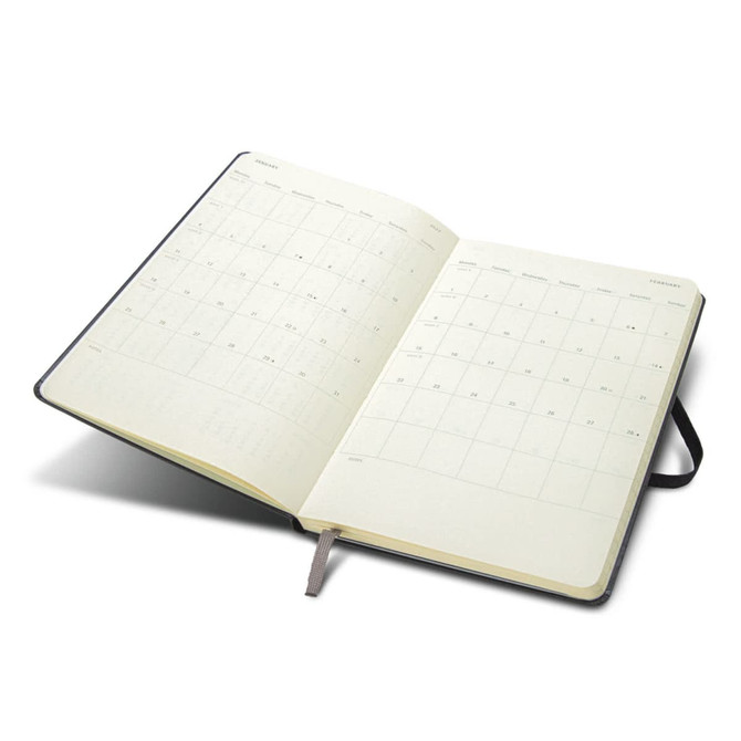 A Moleskine 2027 planner featuring an opened layout with monthly calendar pages, in a dark cover.