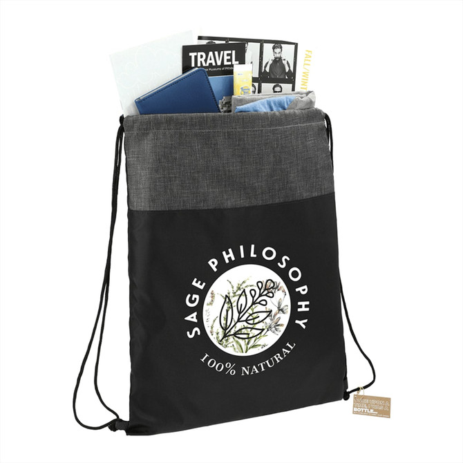 A black and grey recycled drawstring bag filled with various items, including notebooks and a brochure, featuring a logo.