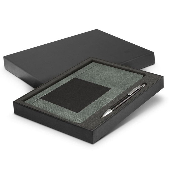 A green notebook and silver pen set displayed in a black gift box. Features a sleek design with a textured cover.