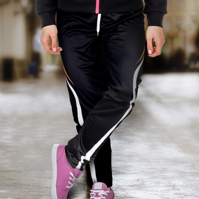 Custom women's sports pants in black with white and orange accents, featuring a relaxed fit and a drawstring waistband.