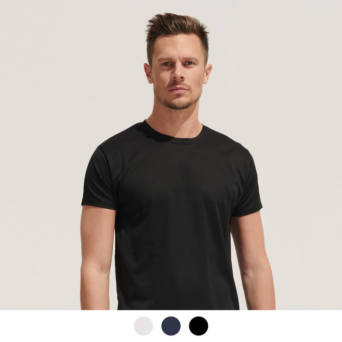 A model wearing a black unisex t-shirt, standing against a light background. The shirt has a logo.