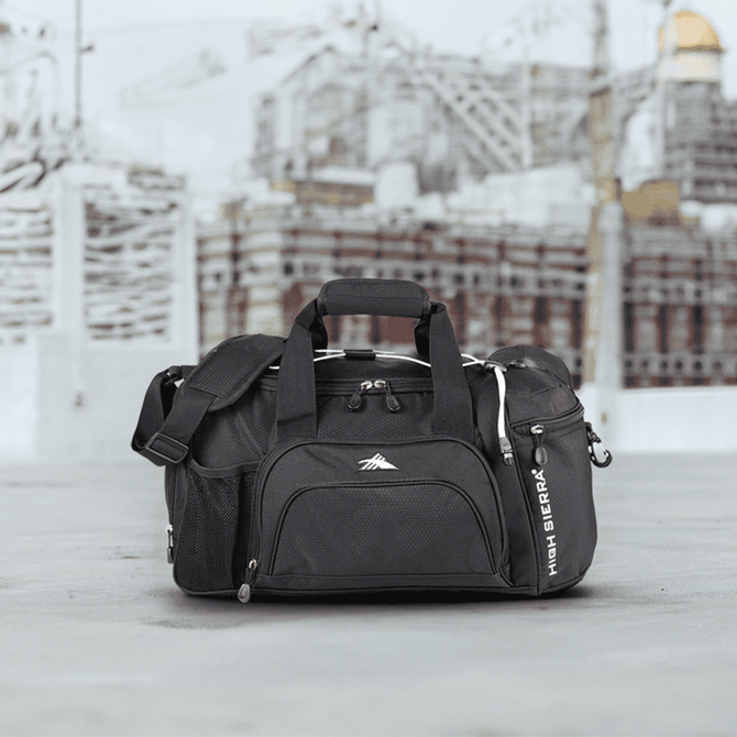 A black High Sierra duffel bag with mesh pockets and a shoulder strap, featuring a logo on the side.