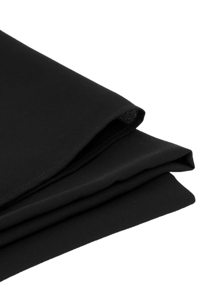 A black womens hijab with a smooth texture, folded neatly for display. It includes a subtle logo.
