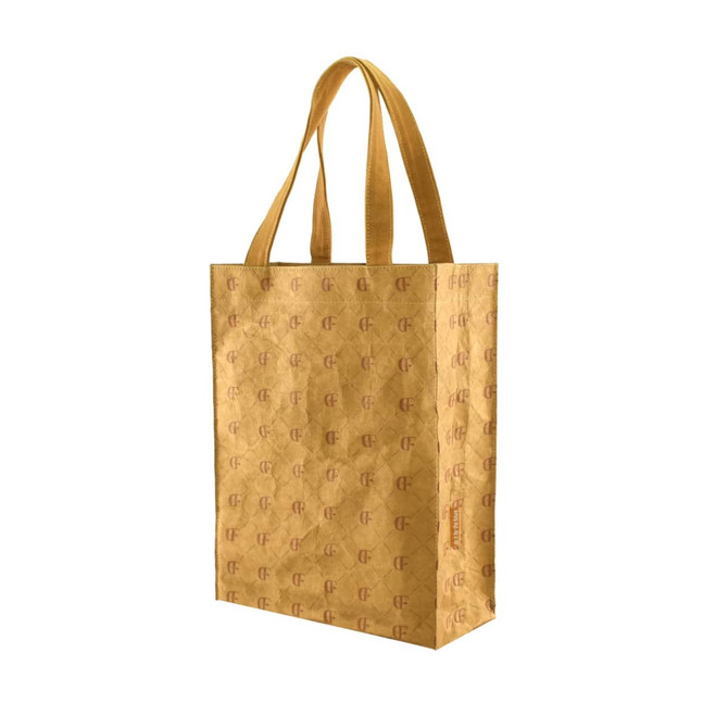 A kraft paper tote bag in a golden brown hue, featuring a subtle logo design.