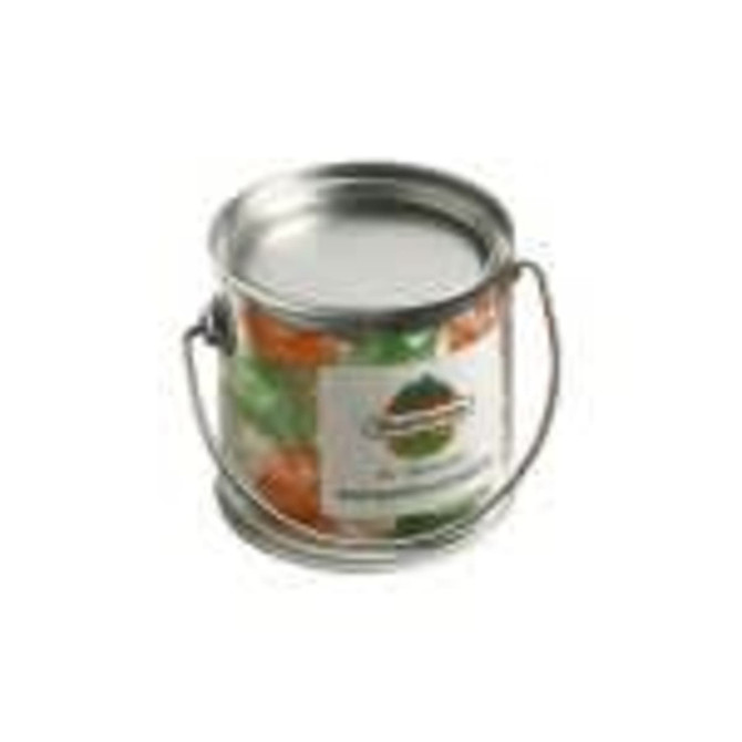 A small silver PVC bucket filled with boiled lollies in vibrant orange, green, and yellow colours.