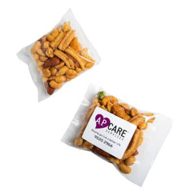 A clear bag containing a mix of nuts and savoury snacks, featuring shades of brown and yellow. The bag has a logo.