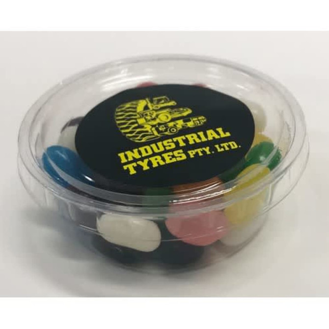 A clear tub filled with colourful jelly beans in various shades, featuring a logo on the lid.