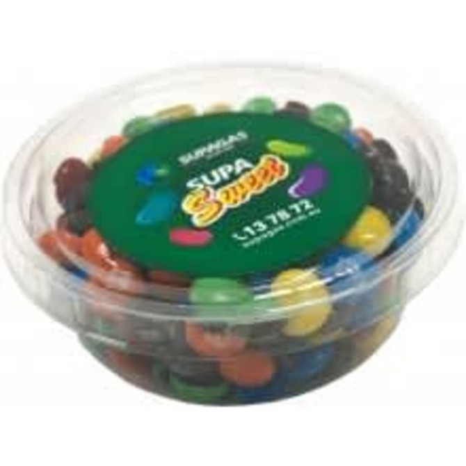 A tub filled with colourful chocolate-coated candies, featuring vibrant red, blue, yellow, green, orange, and black M&Ms.