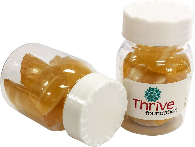 Two clear jars containing yellow eucalyptus lollies, featuring a white lid and a logo on the label.