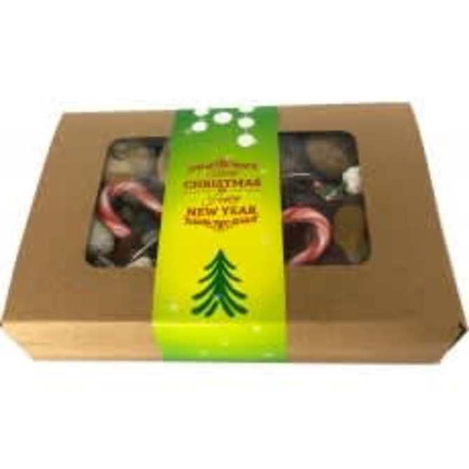 A kraft gift box containing mixed lollies, including candy canes, with a green sleeve and festive design.