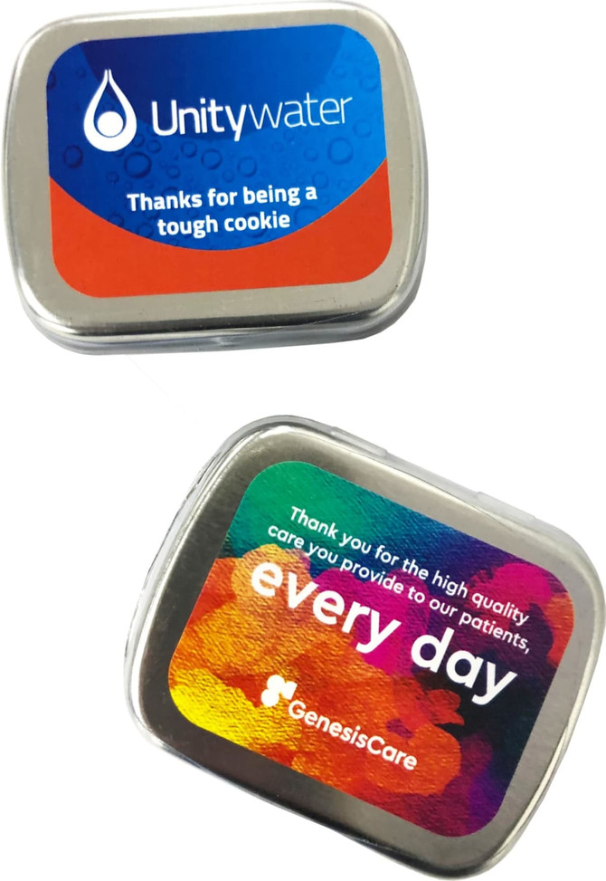 A small rectangular tin in silver, featuring colourful designs and logos, containing mints.