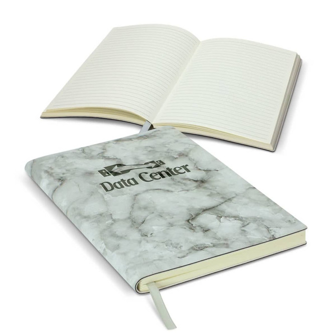 A marble-patterned soft cover notebook with lined pages, featuring a logo on the front.