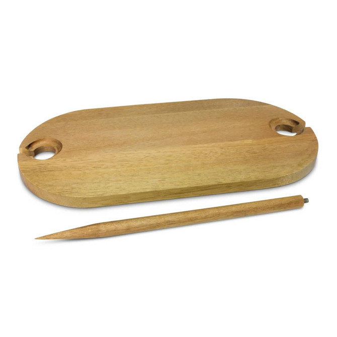 A wooden picnic serving board with two circular cutouts and a pointed wooden stick beside it.